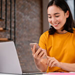 young-woman-using-phone-while-attending-online-class (1)